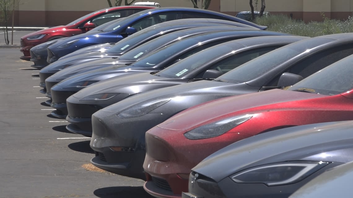 This Scottsdale movie theater was boarded up. Now hundreds of Teslas are being stored on the property.