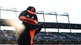 Orioles fan vies for MLB catch of the year with drink, phone, baby stroller in tow