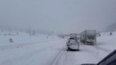 Traffic queues as heavy snowstorm hits Colorado’s mountain roads