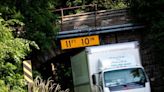 Truck gets stuck driving under historic Dexter Railroad bridge