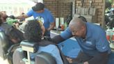 Man hosts mobile barbershop at Juneteenth event to support KCPS Foundation