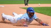 Royals score 3 in ninth to shock Padres, avoid sweep