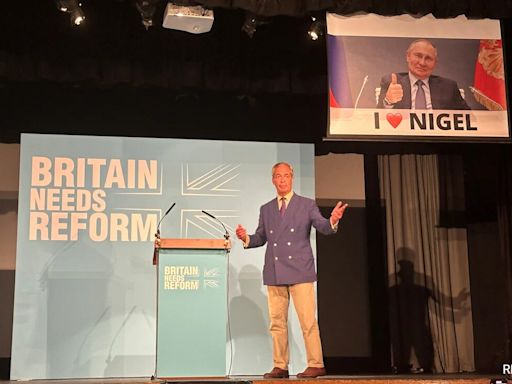 UK Reform Leader Nigel Farage's Speech Interrupted By Banner Mocking Putin Views