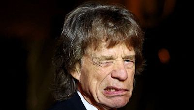 Sir Mick Jagger, 80, puts on an animated display at an Olympics event