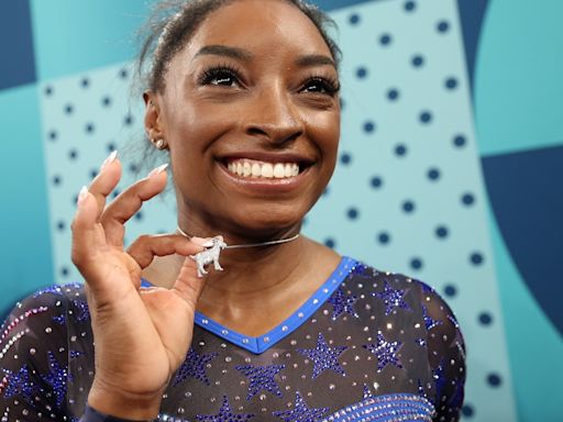 Simone Biles shows off sparkling goat necklace amid historic Olympic gold medal win