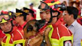 5 firefighter dogs who rescued people from natural disasters are honored in Ecuador as they retire