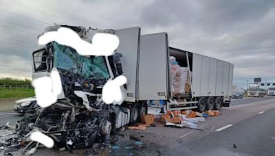 Dramatic images show carnage on motorway after five lorries involved in smash as drivers told AVOID the area