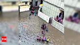 School Kids Struggle with Waterlogging Issue at Tikri Kalyan School in Delhi | Delhi News - Times of India