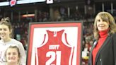 Forty years after she last played for Wisconsin, Theresa Huff's No. 21 jersey is raised to rafters of Kohl Center