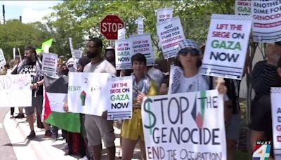 Peaceful demonstrators take a stand outside Prime Osborn Center during vice president’s visit