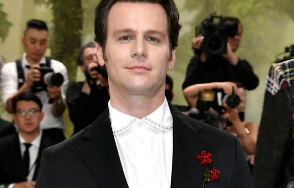 Jonathan Groff sports flower-adorned suit at 2024 Met Gala; Esquire and British GQ approve