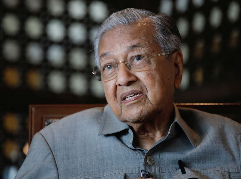 Malaysia’s former PM Mahathir hospitalised over coughing