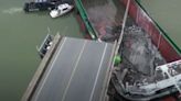 Two dead as ship slams into Chinese road bridge, sending cars flying into river