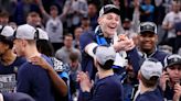 Connecticut's Donovan Clingan, top middle, celebrates with teammates after a 77-52 win against Illinois in the Elite 8 round of the NCAA Tournament at TD Garden on Saturday...