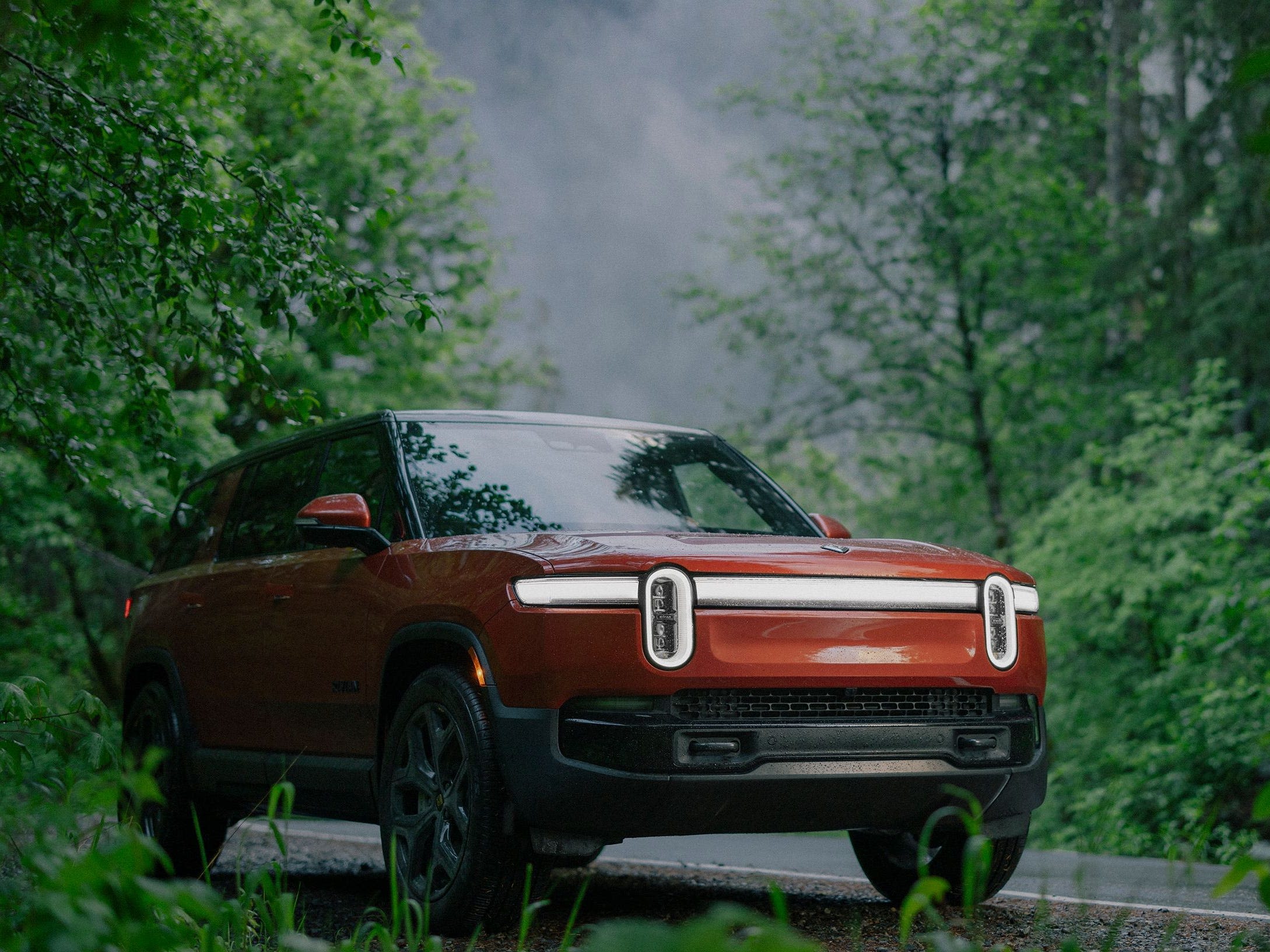 Rivian says its updated electric pickup and SUV are faster and have more range than the Cybertruck