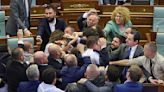 Brawl erupts in Kosovo's parliament during prime minister's speech on defusing tensions with Serbs