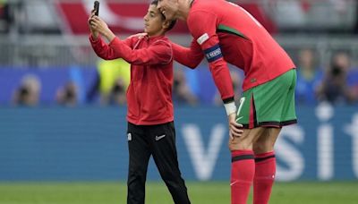 UEFA fines its Euro 2024 co-organizer Germany over selfie-seekers on field with Cristiano Ronaldo