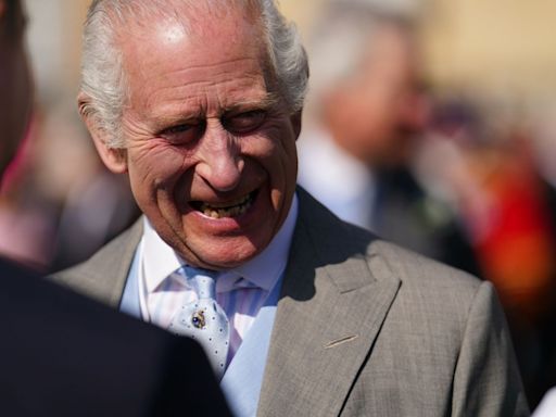 Charles beams alongside Royal Family at Buckingham Palace Garden party