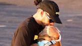 Lewis Hamilton plants a kiss on his beloved bulldog Roscoe