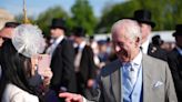 Charles appears in good spirits with guests at Buckingham Palace garden party