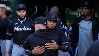 A handful of disgruntled Marlins fans protest the team following the Luis Arraez trade