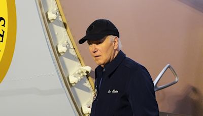 Joe Biden tackles Air Force One stairs with extra caution after covid diagnosis