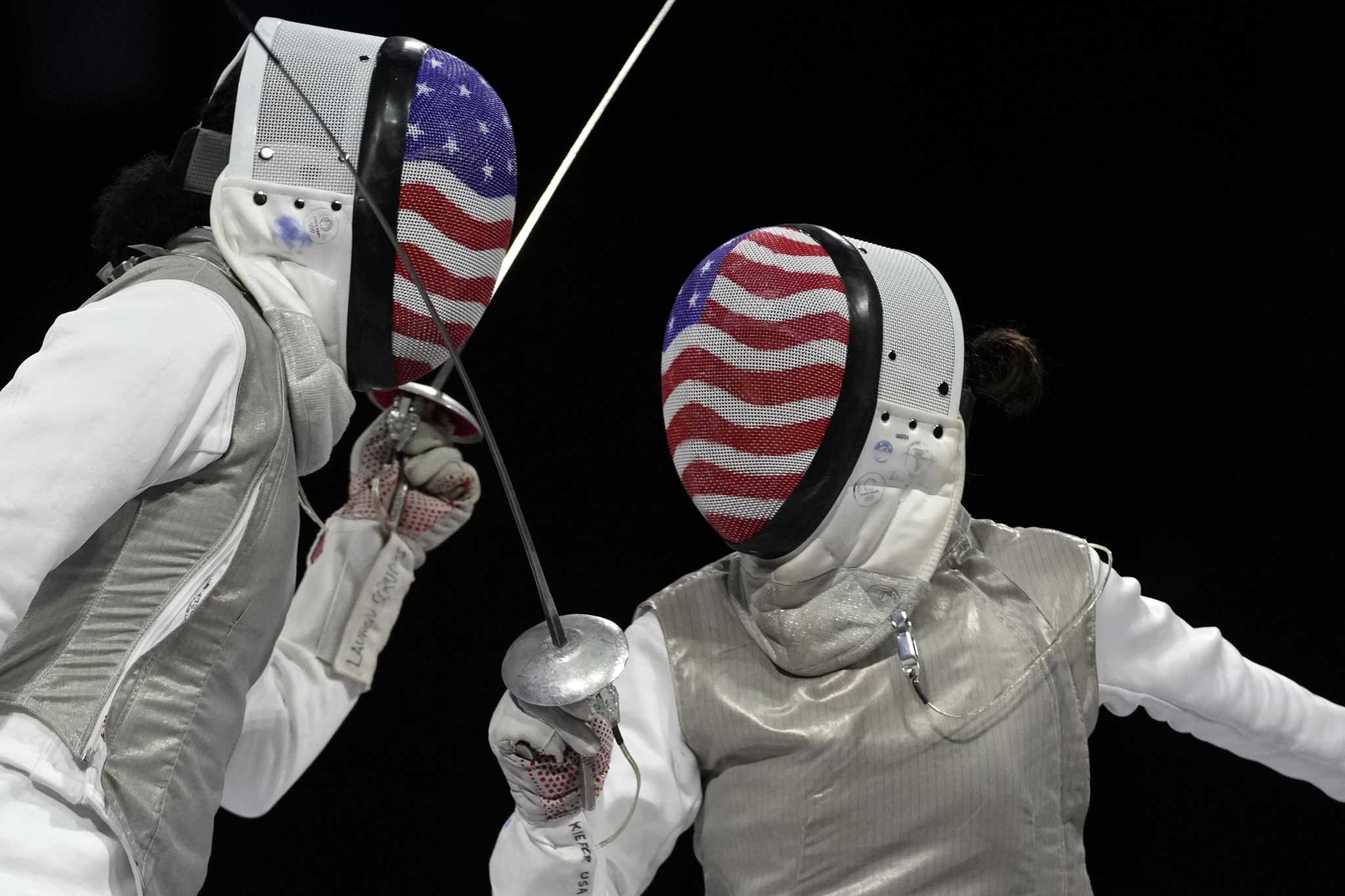 Kiefer earns 2nd Olympic gold in women's foil fencing with a victory over American teammate Scruggs