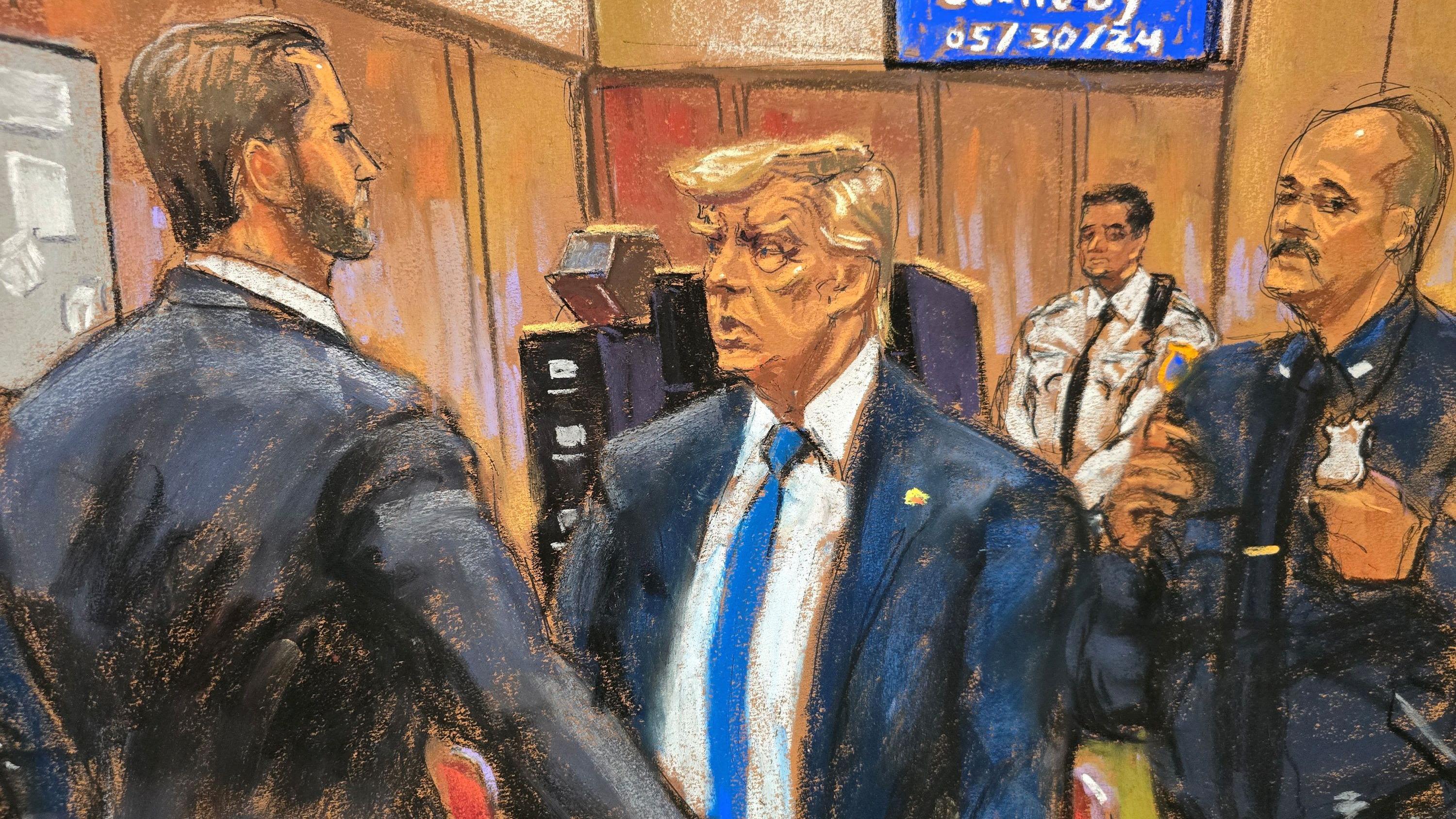 Trump sits motionless as guilty verdict delivered