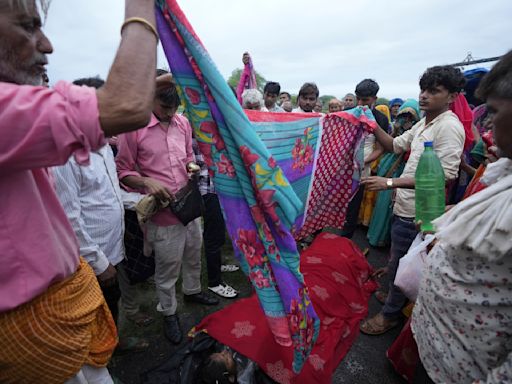 AP PHOTOS: Families of stampede victims in India ponder future without loved ones