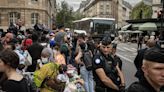 Paris charity workers decry police operations clearing out encampments ahead of the Olympic opening ceremony