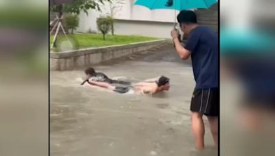 「員中湖」重現 雨彈積水學生趴下游泳