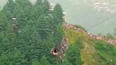 All seven children and teacher rescued from cable car dangling 900ft above Pakistan ravine