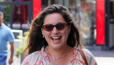 Kelly Brook cuts a summery figure in a floral maxi dress