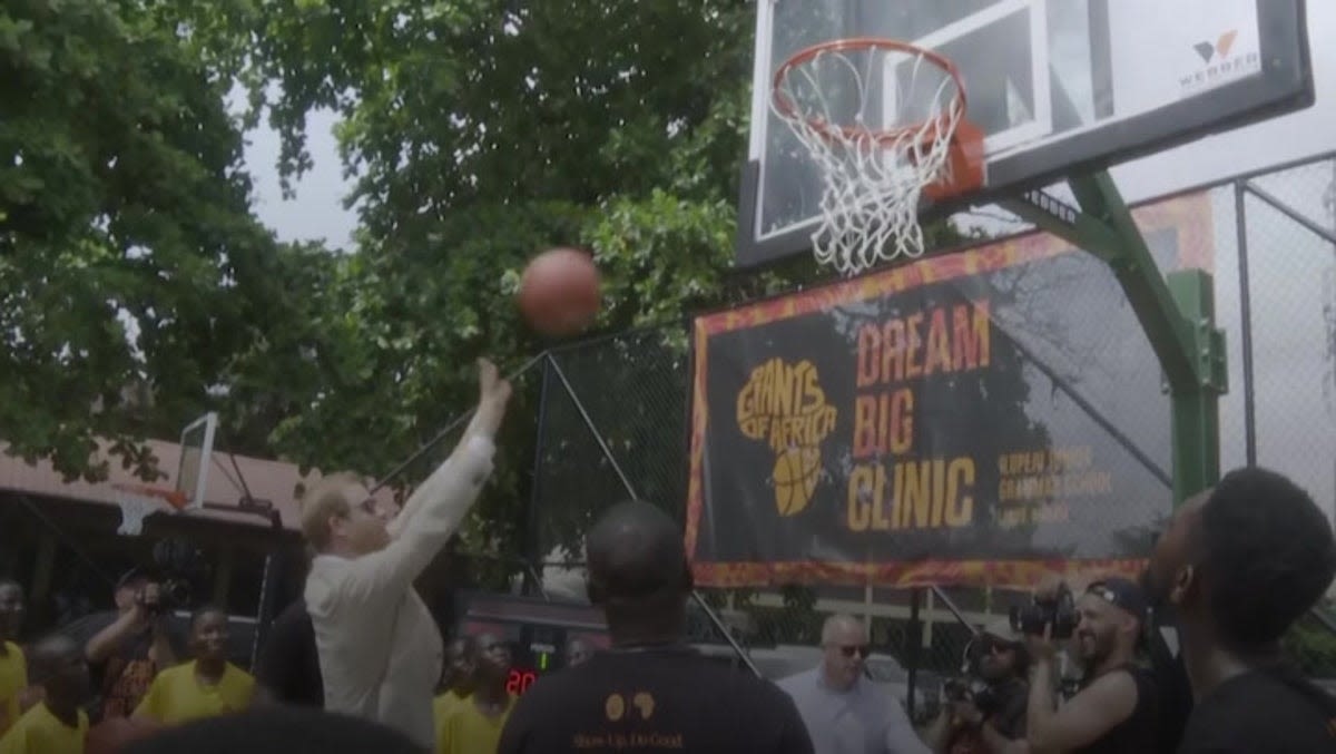 Prince Harry shows off basketball skills as Meghan watches on during visit to Nigeria