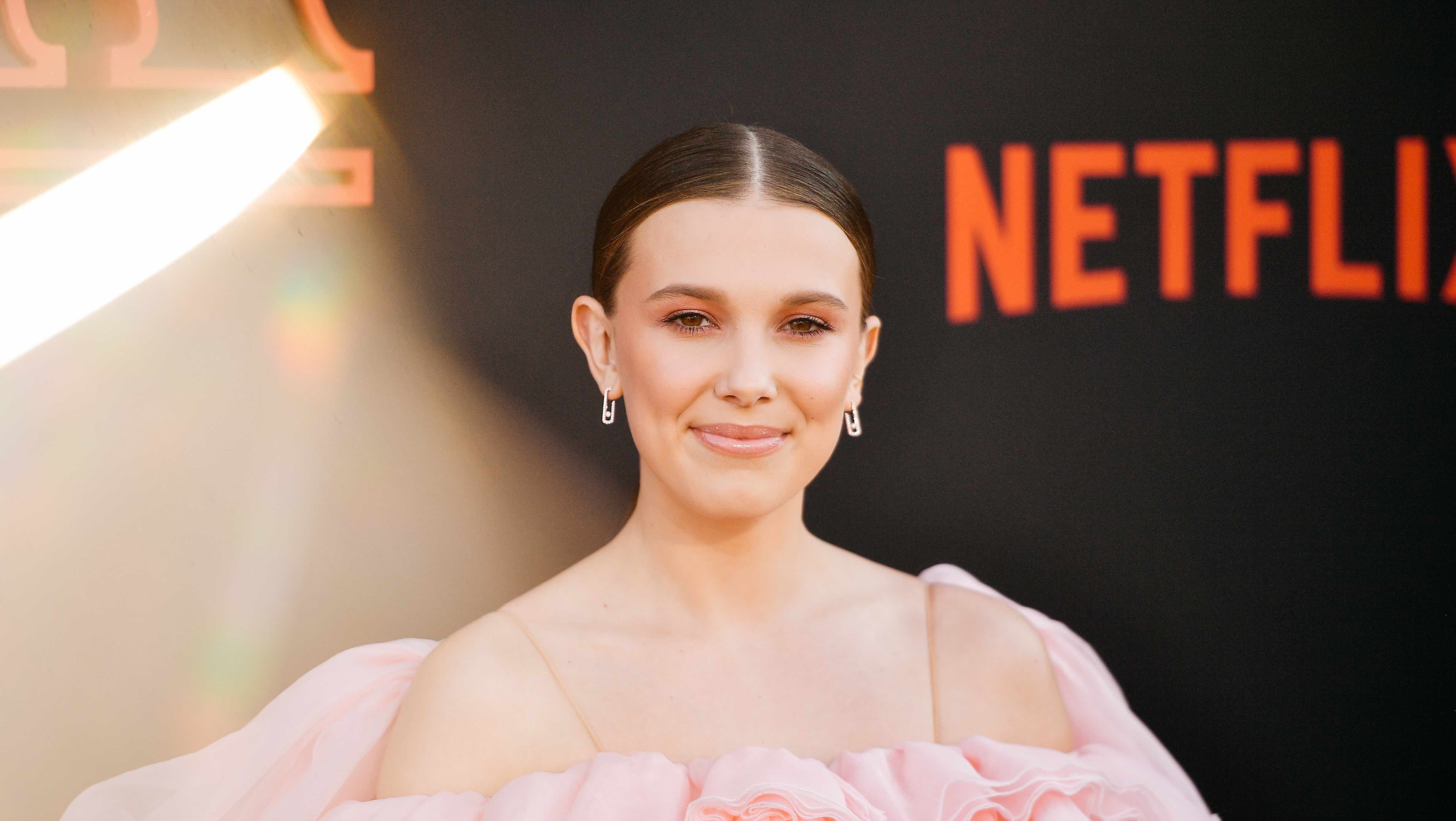 Millie Bobby Brown Is a Blonde Beauty In Head-to-Toe Purple