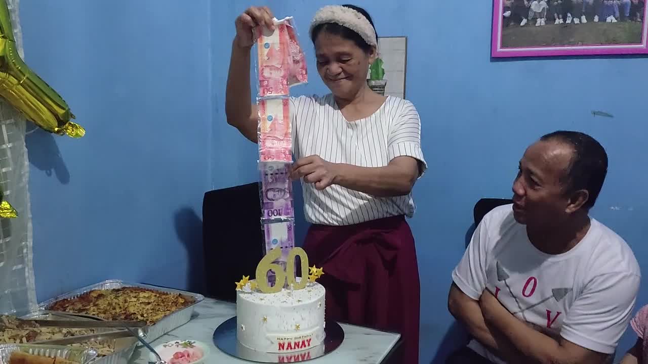 Filipinos Surprise Their Mother With Money Pulling Cake On Her 60th Birthday