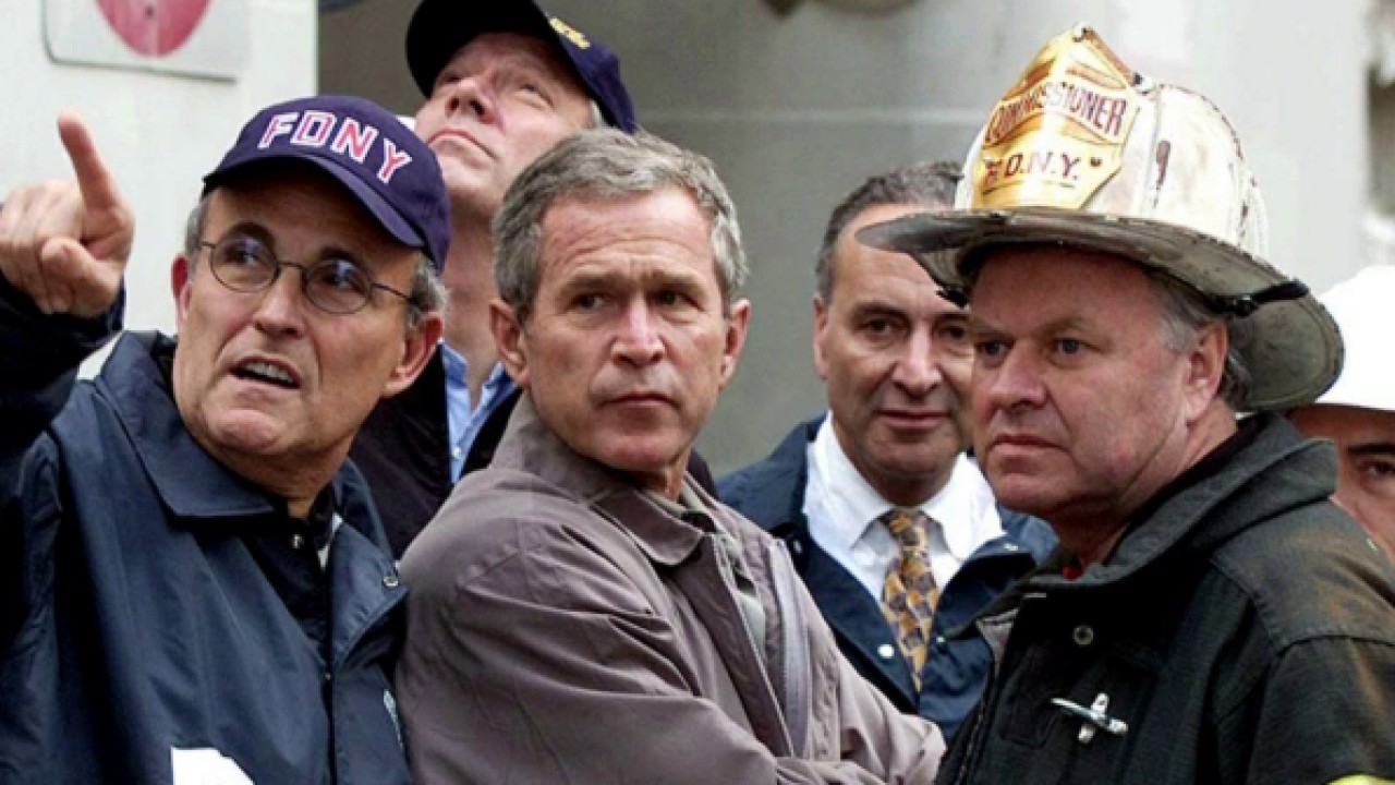 Mayor Giuliani, wearing NYPD cap, is in the midst of a crush of News  Photo - Getty Images