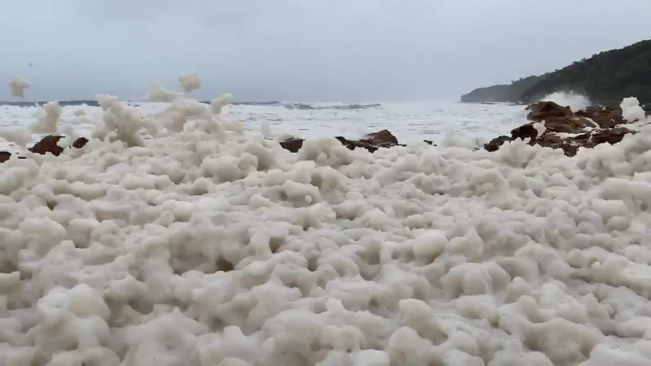 Storms stir up sea foam on Australia's coast
