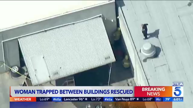 Crews Rescue Naked Woman Wedged Between 2 Buildings In Southern California