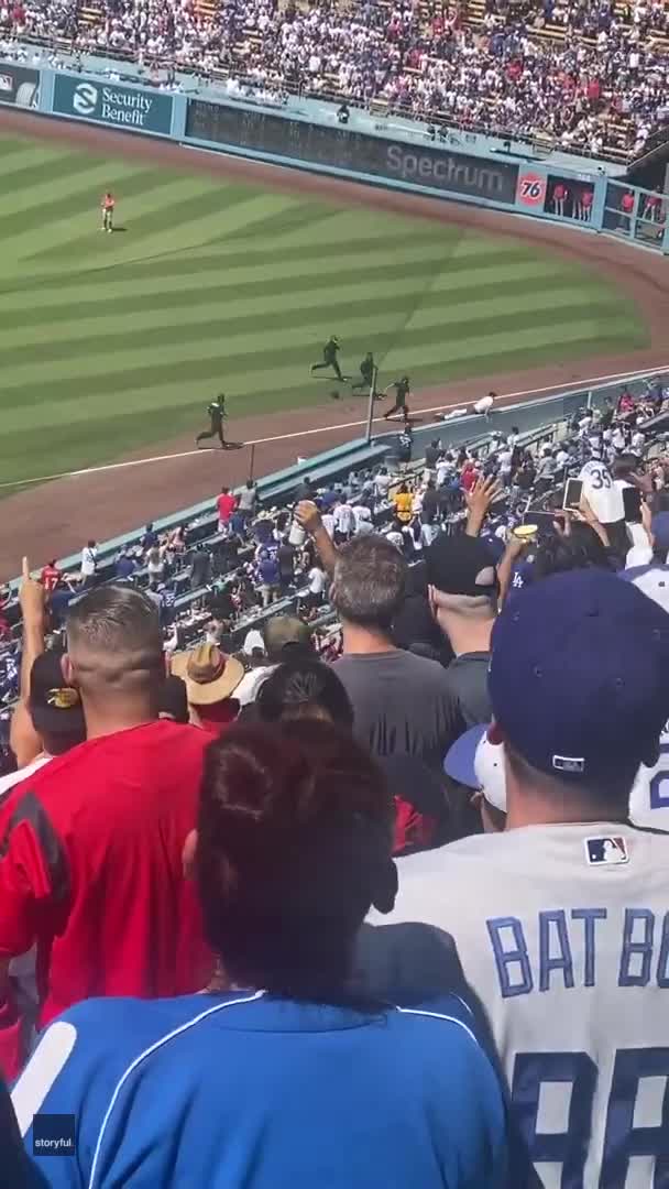 PICTURED: LA Dodgers ball girl, 24, tackled field invader and knocked him  over after 7 guards failed