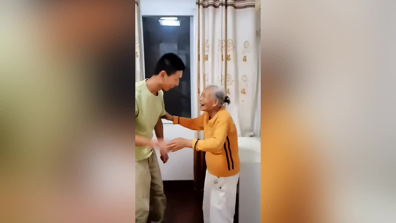 Grandmother laughs uncontrollably after being surprised by returning  grandson in China