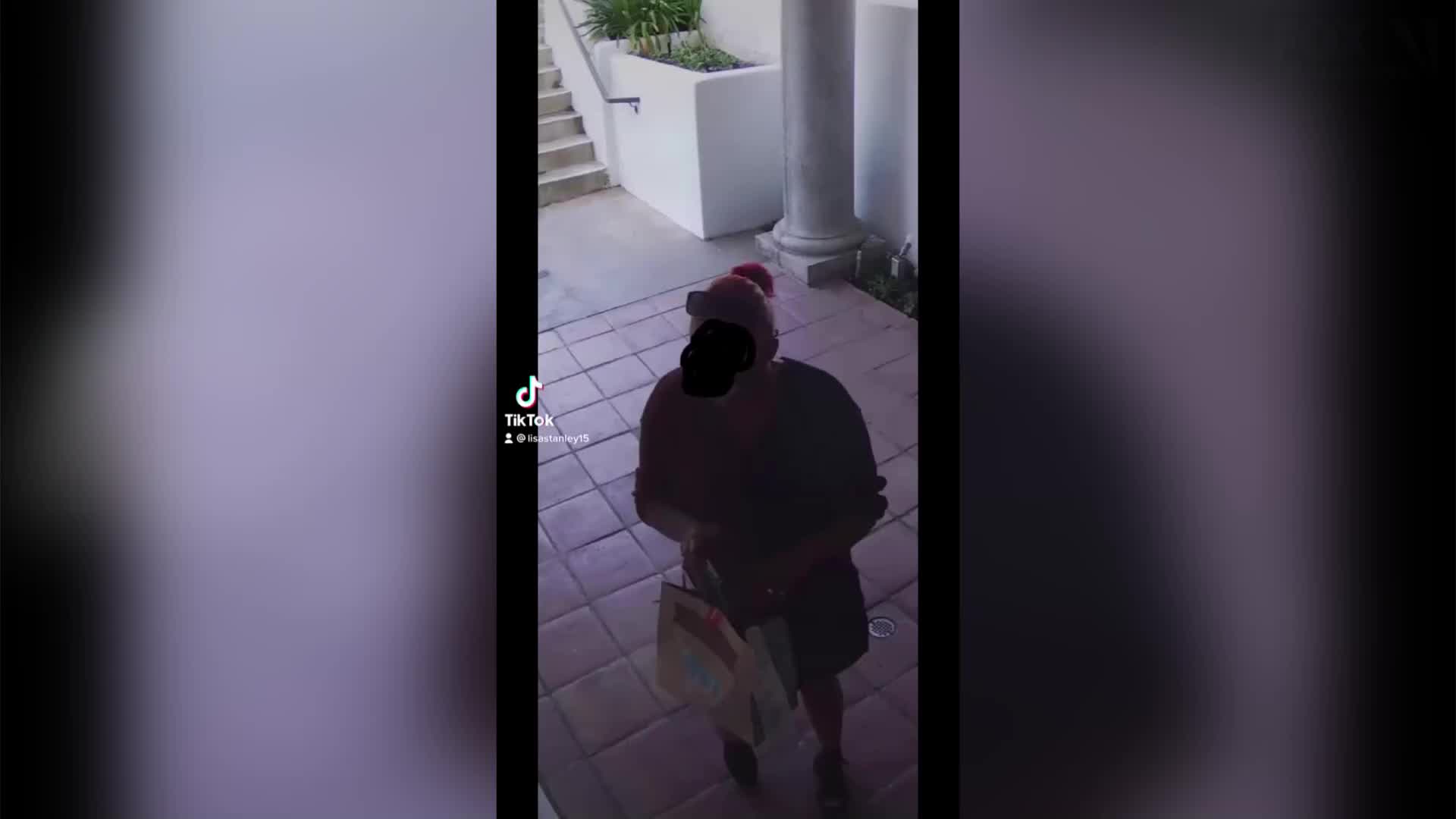 DoorDash driver photographed using residential building&#39;s lobby as toilet