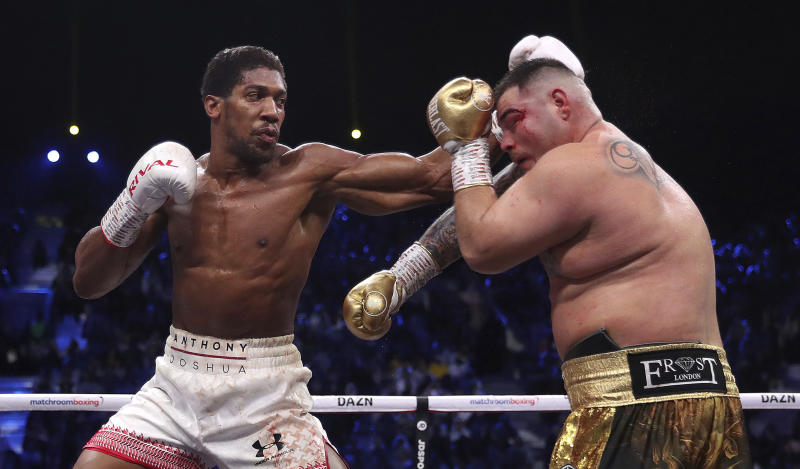 Defending champion Andy Ruiz Jr., right, during his fight against Britain's Anthony Joshua in their World Heavyweight Championship contest at the Diriyah Arena, Riyadh, Saudi Arabia. (Nick Potts/PA via AP)