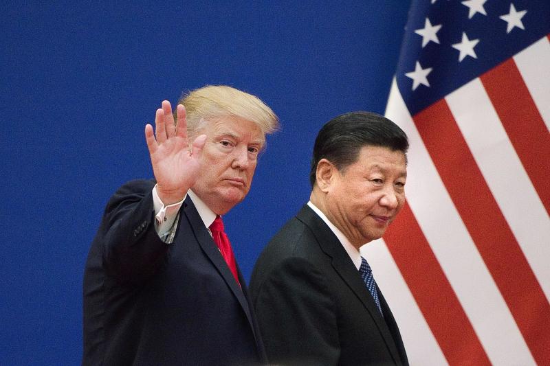 (FILES) This file picture taken on November 9, 2017 shows US President Donald Trump (L) and China's President Xi Jinping leaving a business leaders event at the Great Hall of the People in Beijing. - US President Donald Trump on March 1, 2019, urged China to abolish tariffs on agricultural products imported from the United States -- adding that trade talks between the rival powers were going well. "I have asked China to immediately remove all Tariffs on our agricultural products (including beef, pork, etc.)," the president wrote on Twitter. (Photo by Nicolas ASFOURI / AFP)NICOLAS ASFOURI/AFP/Getty Images ORIG FILE ID: AFP_1E382Y