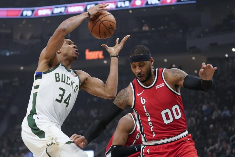 Giannis Antetokounmpo posted a career-high in assists with a triple-double against Portland. (AP Photo/Morry Gash)