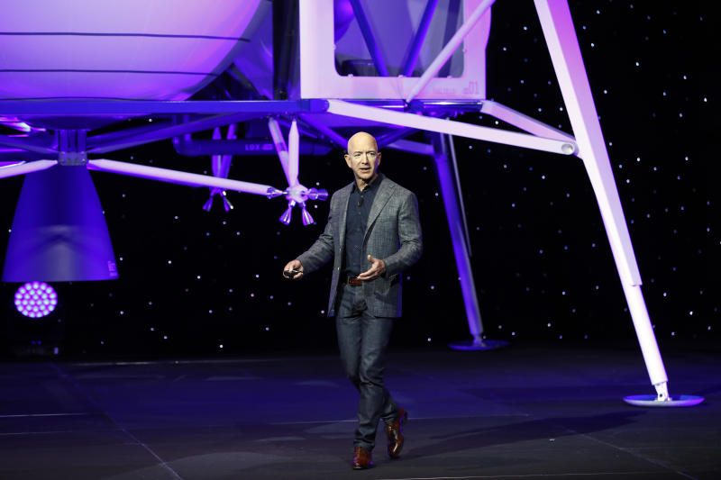 Jeff Bezos speaks in front of a model of Blue Origin's Blue Moon lunar lander, Thursday, May 9, 2019, in Washington. (AP Photo/Patrick Semansky)