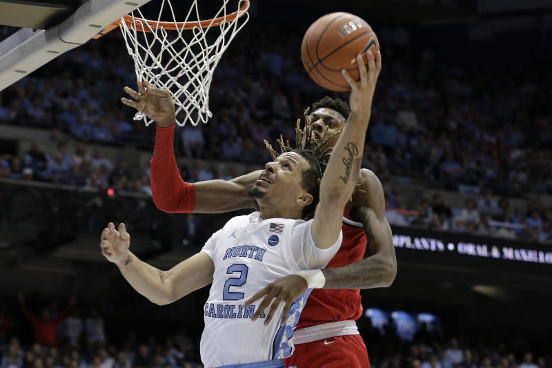 North Carolina guard Cole Anthony (2) drives to the basket while Ohio State forward Alonzo Gaffney defends during the first half of an NCAA college basketball game in Chapel Hill, N.C., Wednesday, Dec. 4, 2019. (AP Photo/Gerry Broome)