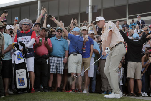 Mackenzie Hughes of Canada hits from off of the 18th hole during the final round of the Honda Classic golf tournament, Sunday, March 1, 2020, in Palm Beach Gardens, Fla. (AP Photo/Lynne Sladky)