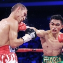 Mexico's Juan Francisco Estrada (L) competes against Brian Viloria of the US during their WBO/WBA world flyweight title bout at the 'Fists of Gold' boxing event in Macau on April 6, 2013.  Estrada claimed the WBO and WBA flyweight world titles in Macau with a split points decision victory over reigning champion Brian Viloria. AFP PHOTO / Dale de la ReyDALE de la REY/AFP/Getty Images