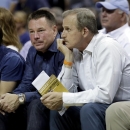 FILE - In this May, 2015 file photo, Tennessee head football coach Butch Jones, center, and head basketball coach Rick Barnes, right, watch the first half of Game 4 of a second-round NBA basketball Western Conference playoff series between the Memphis Grizzlies and the Golden State Warriors in Memphis, Tenn. The new coaching quartet of Barnes, Avery Johnson, Ben Howland and Mike White will join the rest of the SEC in looking to knock off John Calipari and his Kentucky Wildcats. (AP Photo/Mark Humphrey, File)